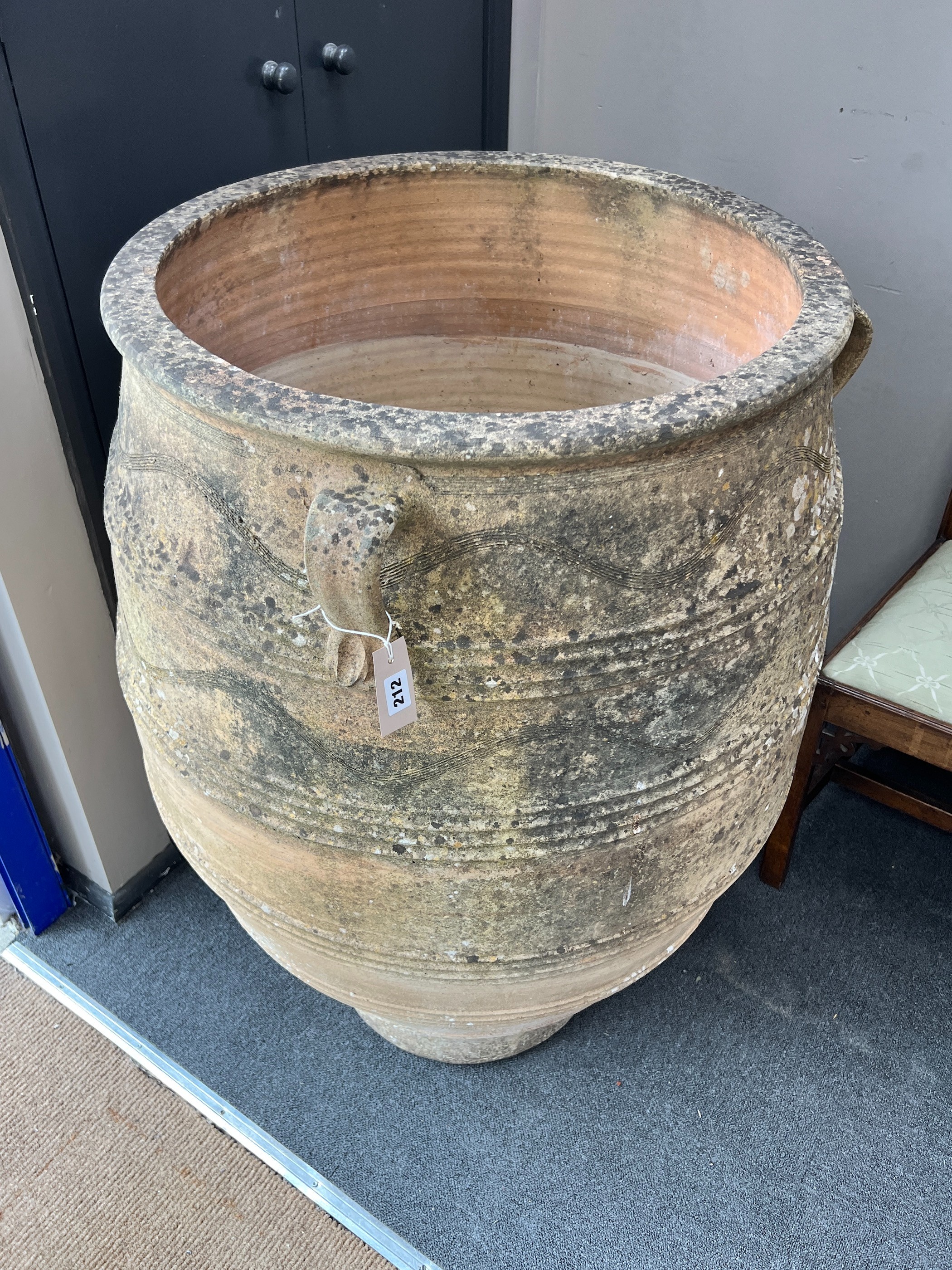 A large Grecian style incised terracotta oil jar, height 105cm